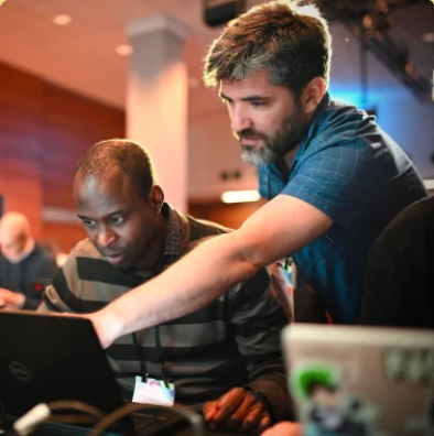 men looking at a laptop